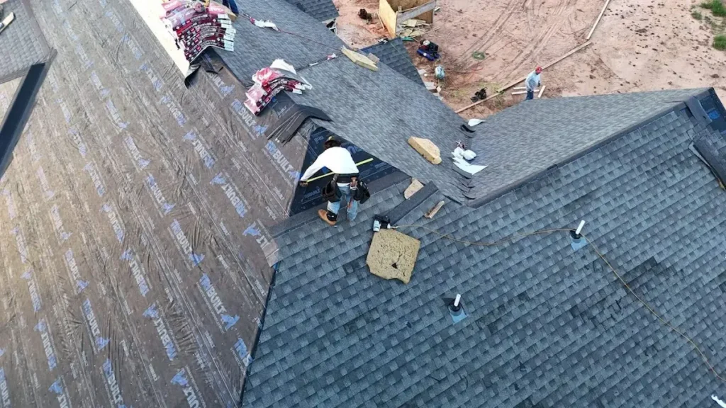 5Coat workers fixing roof