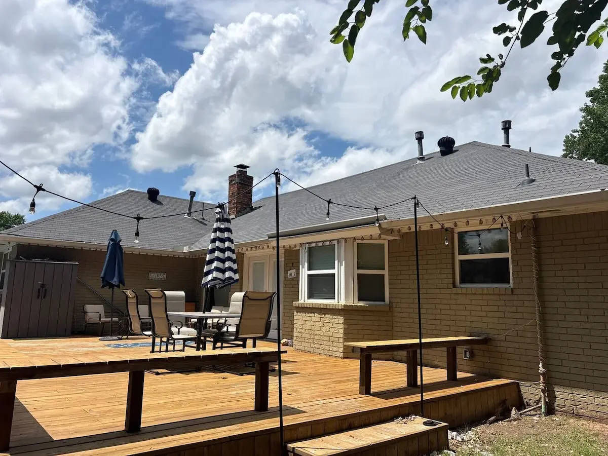 Grey house with wooden deck