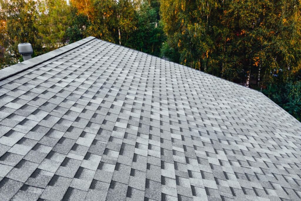 newly renovated roof with shingles flat polymeric roof-tiles